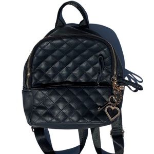 Diamond cross stitching small adjustable straps all black leather backpack